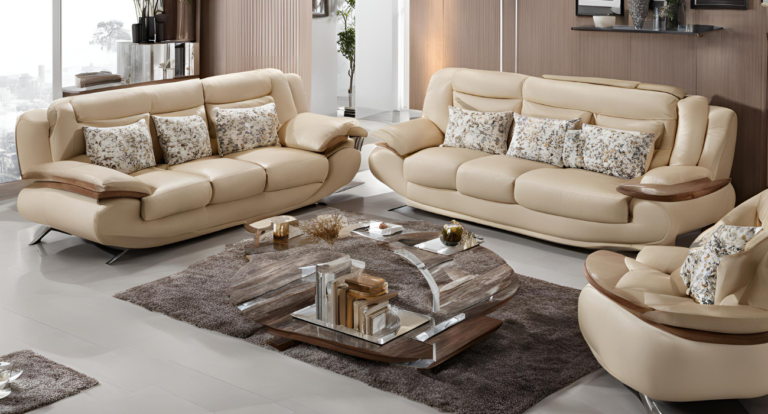 A modern living room with beige leather sofas adorned with floral pillows. A unique wooden and metal coffee table on a gray rug adds elegance.